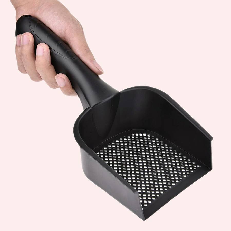outil nettoyage chat plastique noir